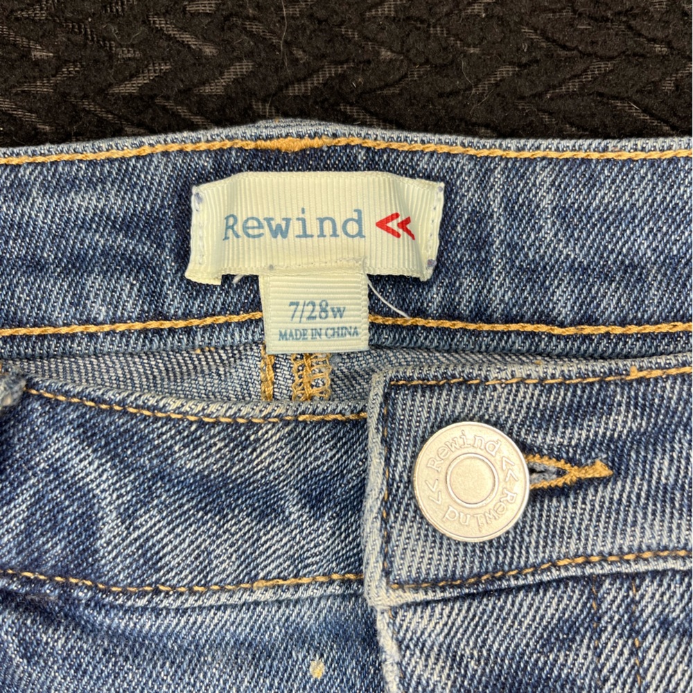 Dark blue cut up denim jeans